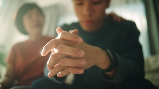 istock Teenager stressing on sofa with her mother. 2190784850
