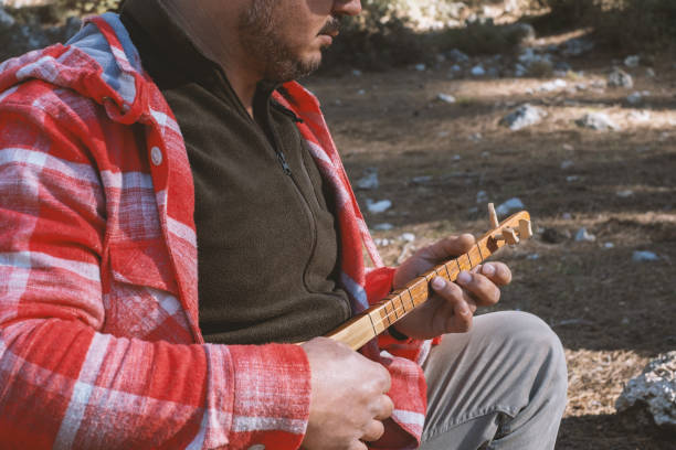 Playing Turkish Musical Instrument Cura