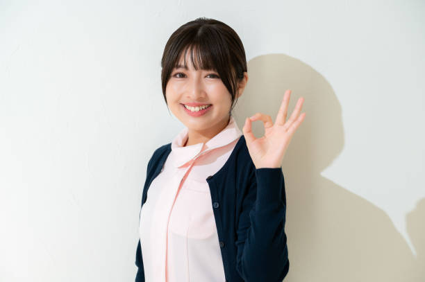 istock Japanese clinic staff posing OK on a white background 2190788213