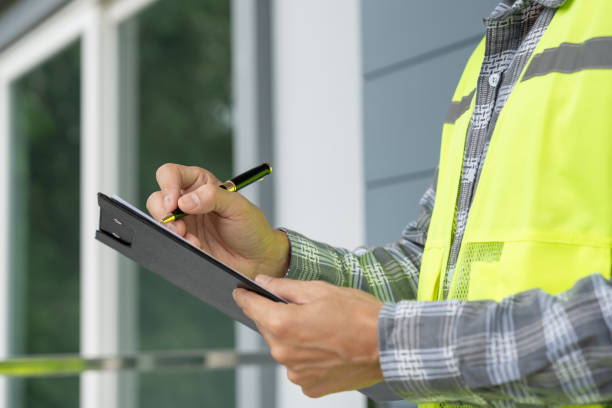 istock inspector or engineer is inspecting construction and quality assurance new house using a checklist. Engineers or architects or contactor work to build the house before handing it over to the homeowner 2190789165