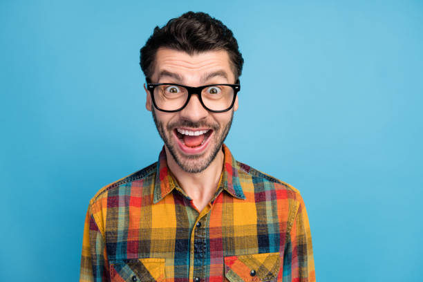 istock Photo of impressed ecstatic handsome guy in spectacles dressed checked shirt staring at discount isolated on blue color background 2190789745