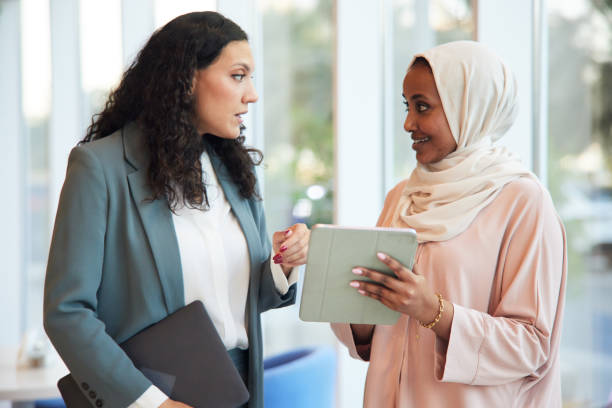 istock In the one-on-one standing business meeting, both professionals exchange ideas while standing. 2190794012