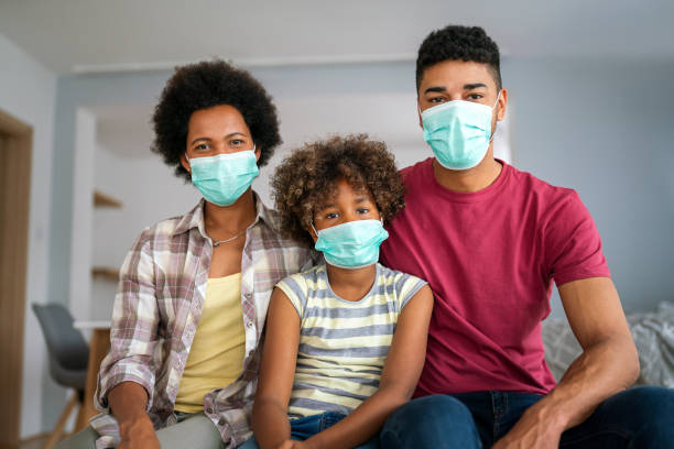 istock Family is wearing facemasks during coronavirus and flu outbreak. Virus and illness protection, COVID 2190794125