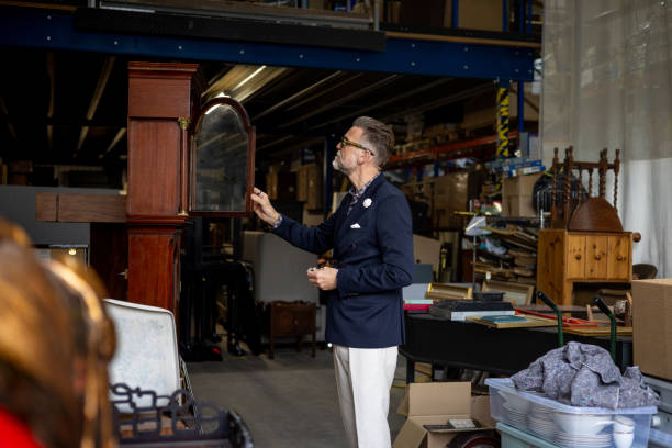 istock Antique Dealer With Antique Clock 2190796456