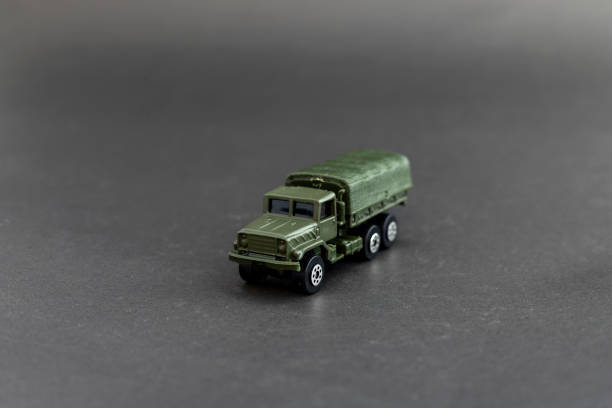 istock Military truck scale model isolated on black background 2190797150