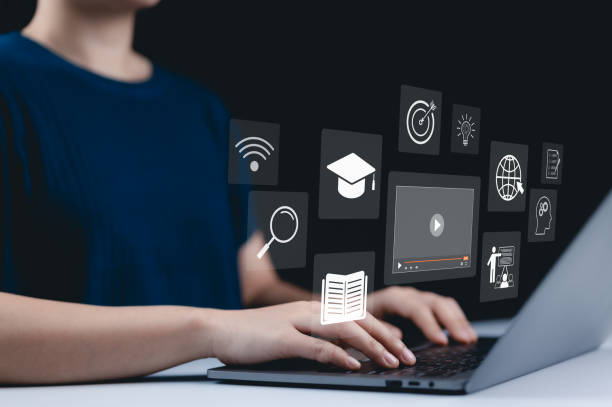 istock Online education and e-learning concept. A person use a laptop with icons representing online education, learning, knowledge sharing, educational tools, training, webinar on internet, digital courses, 2190797956