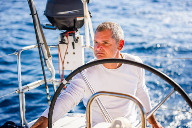 istock Skipper sailing on sailboat 2190798484