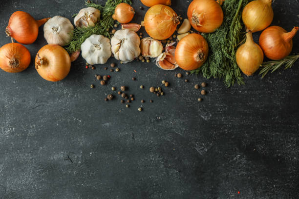 istock Fresh onions, garlic, dill, and peppercorns arranged on a dark rustic background. Perfect for culinary concepts, food styling, or showcasing organic ingredients 2190800666