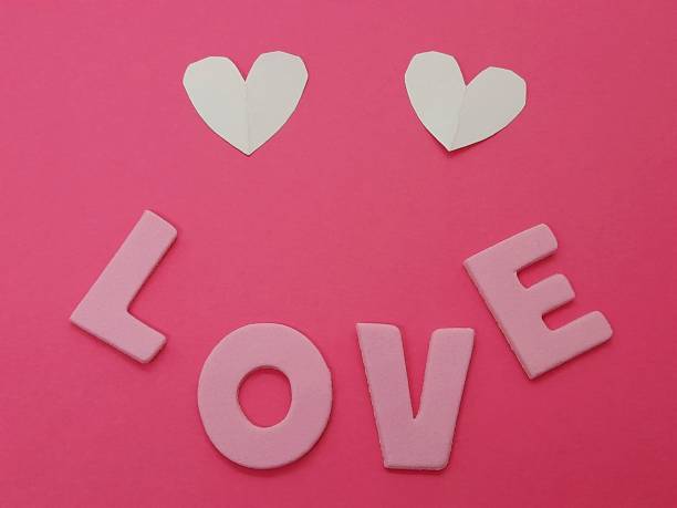 istock Happy face with heart shapes and love subtitle or text. 2190802470