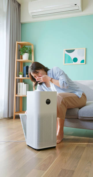 istock woman check dirty air purifier 2190803583
