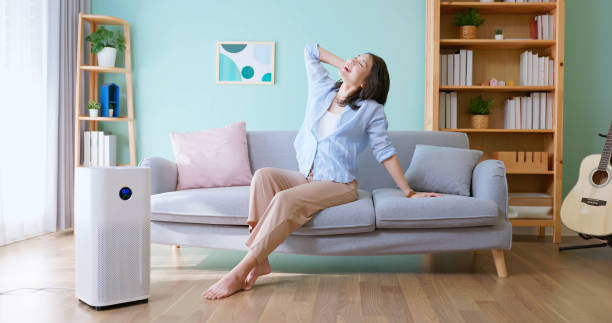 istock woman use air purifier home 2190803592