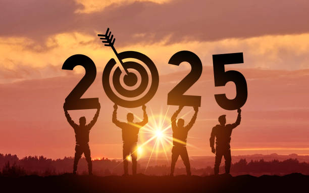 istock Silhouette people holding numbers 2025 with colorful dramatic sky at sunset. Hit the target. Concept for success in the future goal and passing time. Template Vector illustration. 2190804112