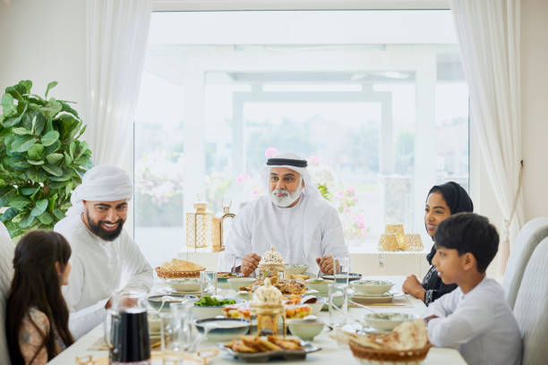 istock Happy middle eastern family members enjoying lunch 2190807578
