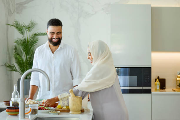 istock Happy Arab couple preparing food in kitchen 2190807713