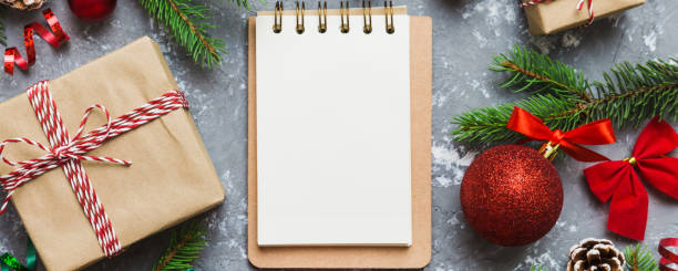 istock Christmas blank greeting card mock-up scene. Creative layout made of Christmas tree branches and paper card note. Flat lay. Nature New Year concept 2190808390