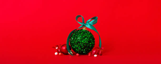 istock Christmas ball on colored background. decoration bauble with ribbon bow with copy space 2190808473
