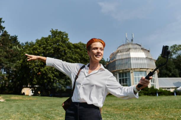 istock Young teacher enjoying remote work in a beautiful outdoor setting with enthusiasm 2190808742