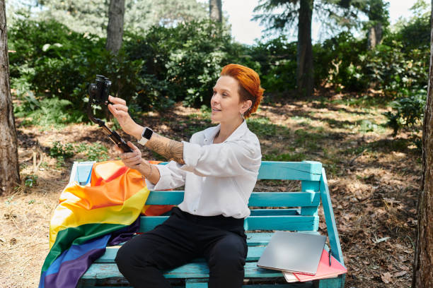 Young remote teacher captures a moment of joy in nature using her smartphone