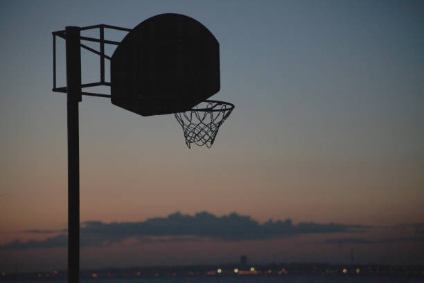 istock basketball hoop at sunset by the sea 2190809322