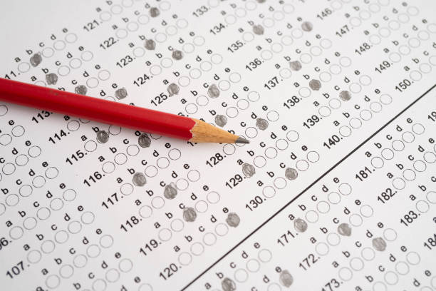 istock Answer sheets with pencil drawing fill to select choice, education. 2190811828