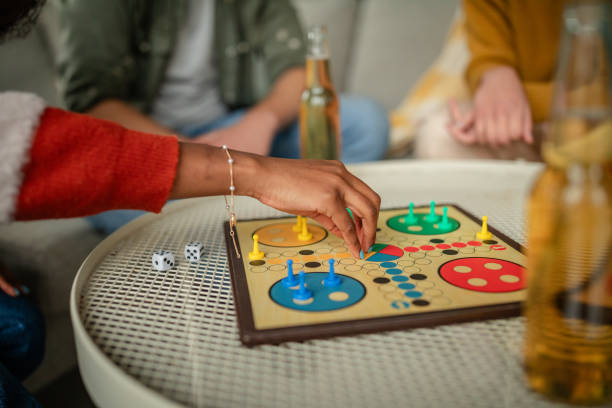 istock Focused hand placing a piece on the game board. 2190827783