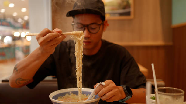 istock Asian hungry man eating noodle ramen. 4K. 2190827944