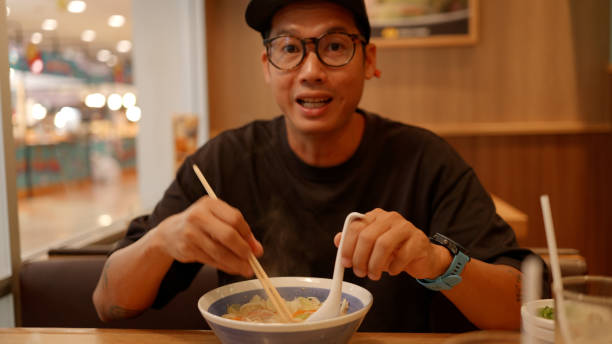 istock Asian hungry man eating noodle ramen. 2190827952
