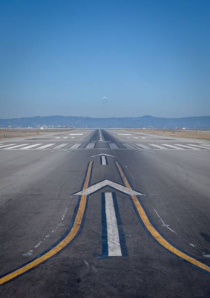 istock Airport runway with airplane taking off. 2190828932