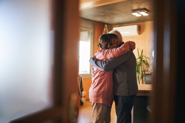 istock enior couple embracing in a warm, cozy home environment 2190830682