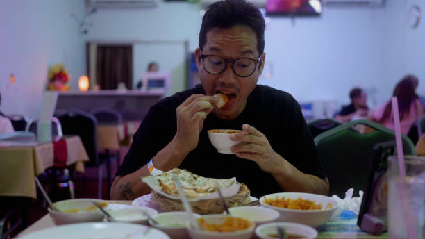 istock Asian man enjoy eating India food. 2190830880