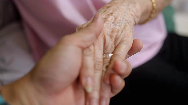istock Holding hands with love and care. 2190831116