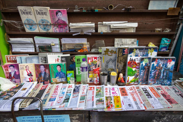 Hong Kong - December 19, 2024 : General view of a news stand in To Kwa Wan, Kowloon, Hong Kong. Many newspapers and magazines are on sell at the news stand.