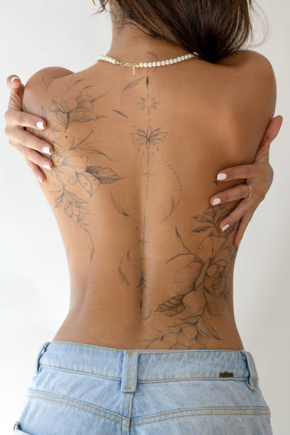 istock Back tattoo of a unrecognizable female 2190833685