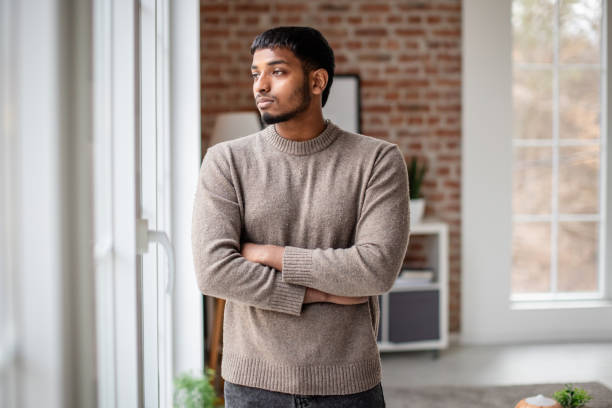 istock Man deep in thought gazing out the window 2190833942