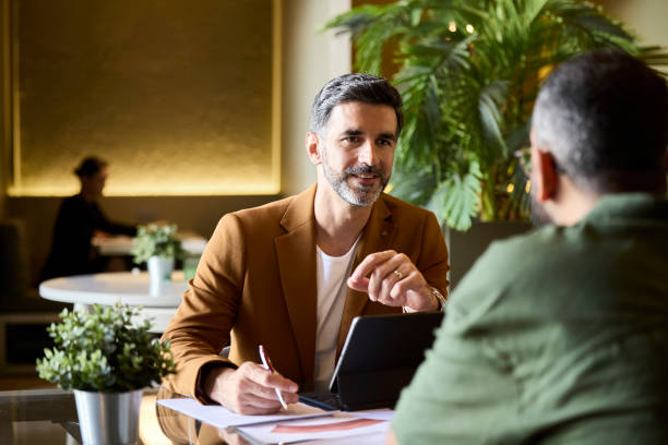 istock Male manager planning strategy with colleague 2190836310
