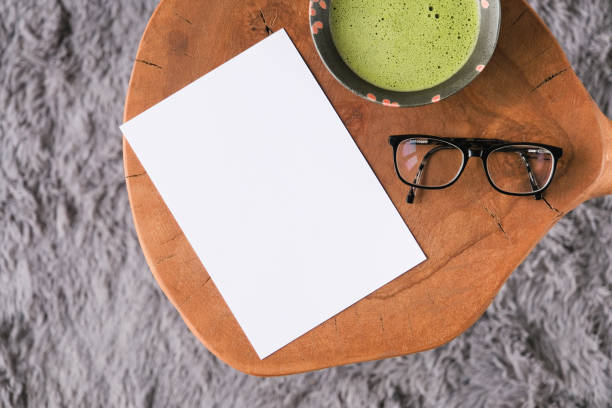 istock blank paper sheet mockup on coffee table with green matcha tea 2190841827