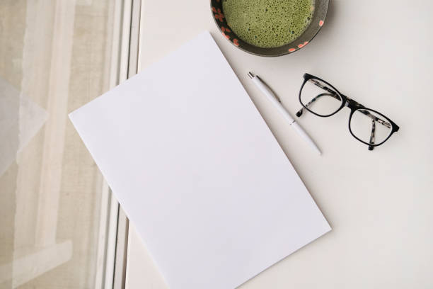 istock blank magazine mockup on coffee table with green matcha tea near window 2190842081