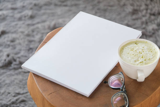 istock blank magazine mockup on coffee table with green matcha tea near window 2190842199
