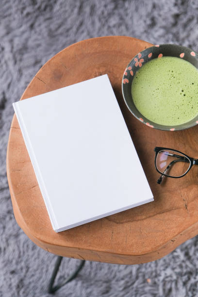 istock blank book cover mockup on coffee table with green matcha tea 2190843043