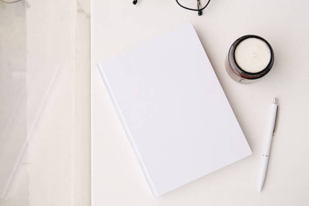 istock blank book mockup on white coffee table with green matcha tea near window 2190843331