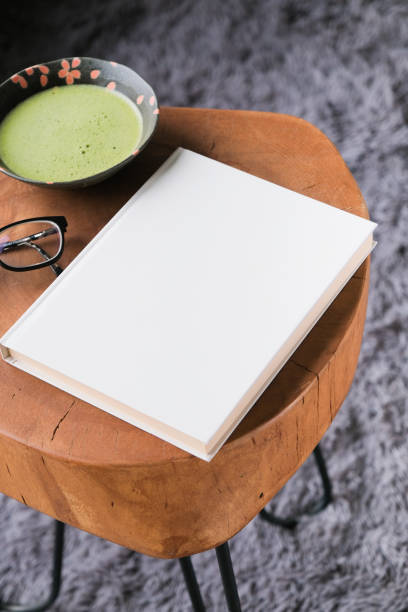 istock blank book cover mockup on coffee table with green matcha tea 2190843502