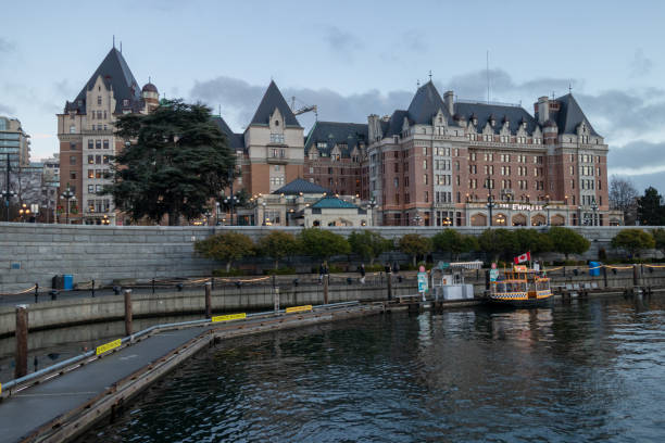 Victoria, British Columbia, Canada - December 7, 2024: The Fairmont Empress Hotel, an iconic landmark, as seen from the inner harbour.