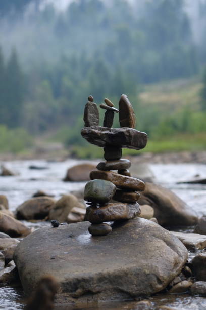 An inukshuk or inuksuk, also known as an inunnguaq when it takes the form of a human, is a stone marker traditionally used by Arctic cultures such as Canada's Inuit to indicate direction or mark a place of respect. They are now seen all across Canada, probably inspired by the inunnguaq that was the symbol of the 2010 Vancouver Winter Olympic Games, which symbolized friendship and welcoming the world. This inukshuk sits on a rocky coastline at Gaff Point near Lunenburg, Nova Scotia, overlooking the Atlantic Ocean.