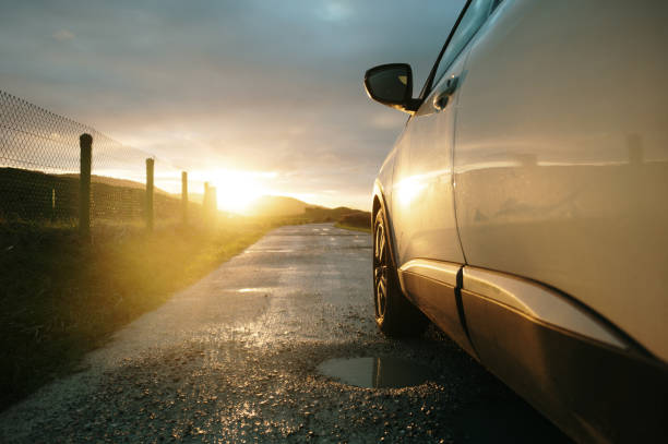 istock Car on a road at sunset 2190847855