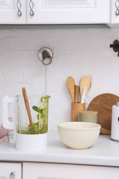 istock A bright kitchen with a powerful dirty blender, mixing bowl, and utensils, ideal for healthy cooking and meal on white kitchen. 2190850949