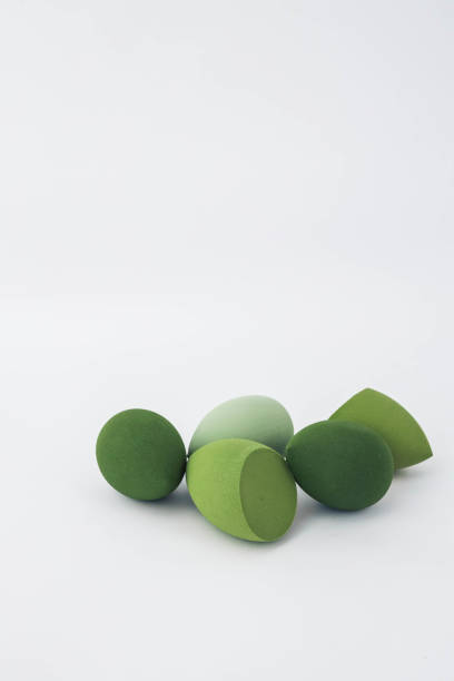 istock Green makeup sponges on a white background. A minimalist composition showcasing beauty tools for foundation blending, perfect for skincare and cosmetics themes 2190851929