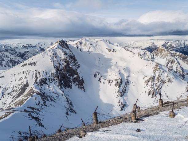 istock Snowy Mountain Slope with Barbed Wire Fence 2190853549