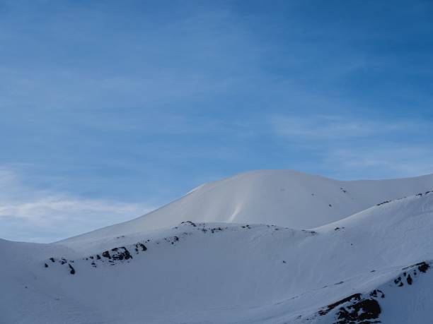 istock Snowy mountain peaks under clear blue sky 2190853711