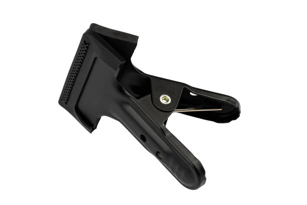 Plastic spring clamps on a metal background