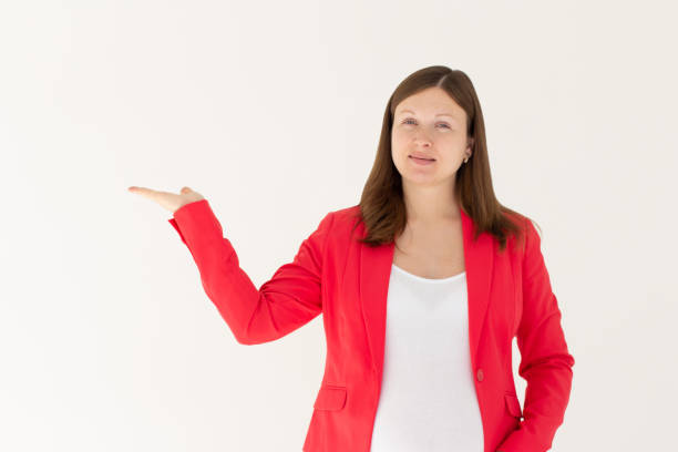 istock European young woman pointing side in white background 2190856783